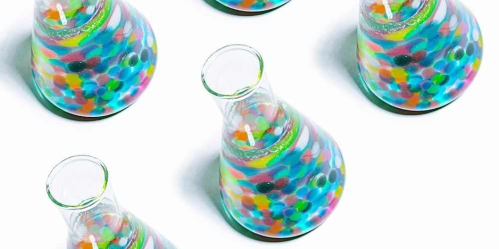 Colourful balls in lab jars